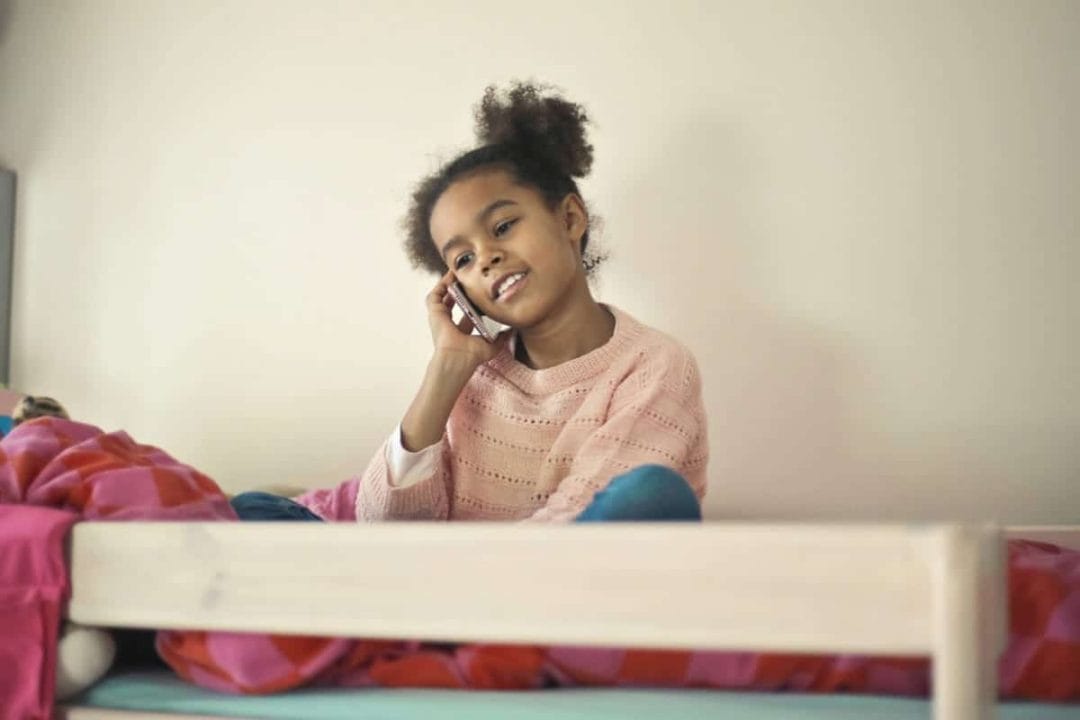Travel and Custody Agreements: How Will Vacation and Travel Plans Work After Divorce? 2 Child calling parent during travel and dealing with parent's custody agreements