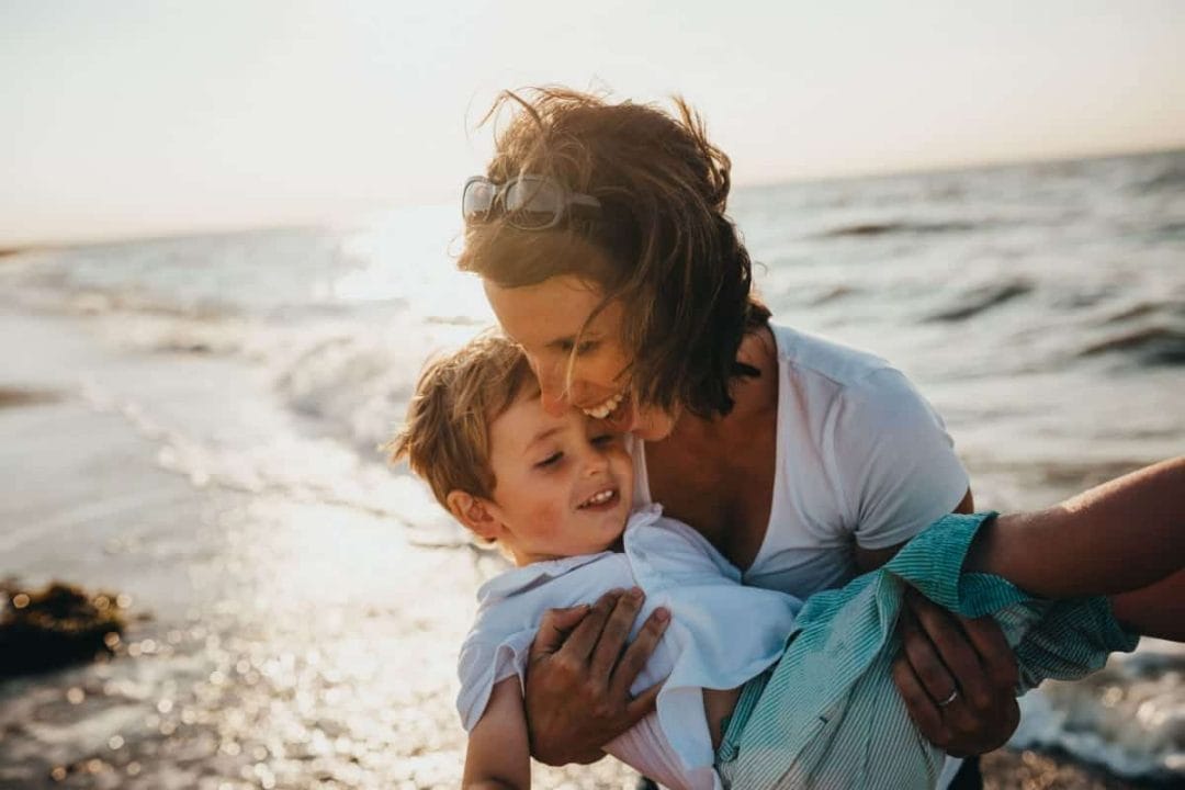 mom with child thinking about travel and custody agreements