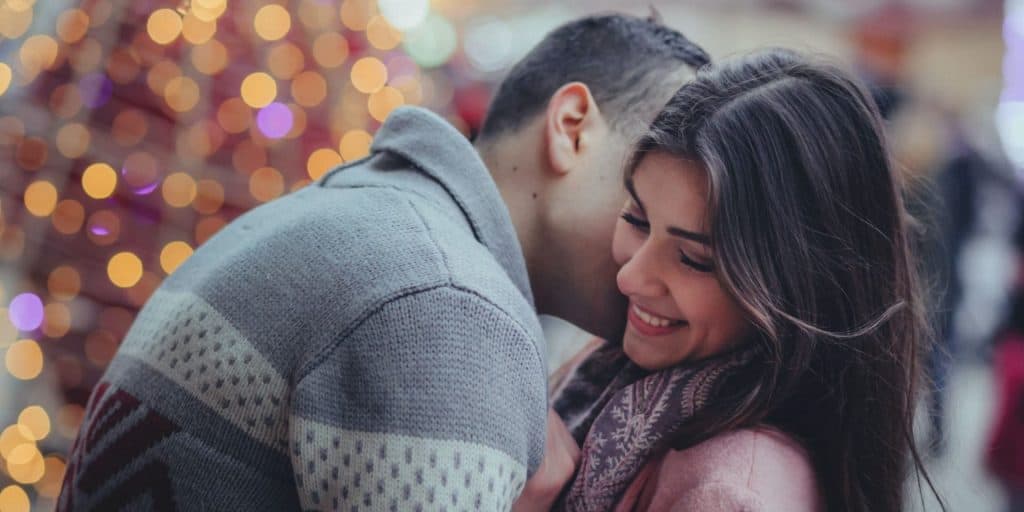 Couple in public kissing, thinking about The Types Of Affairs That Lead To Divorce
