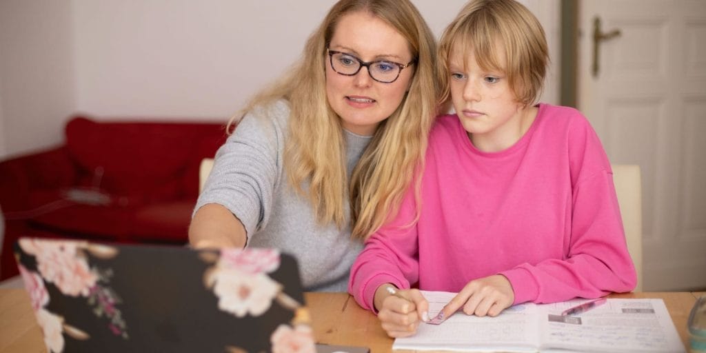 A Non-Custodial Parent working with her daughter on homework