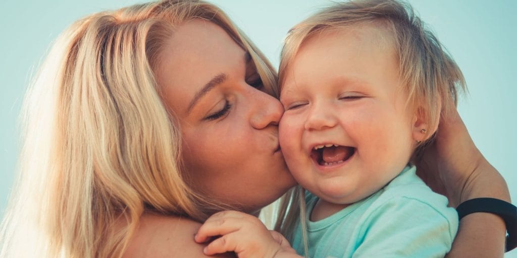 mother holding baby wondering when does child support end