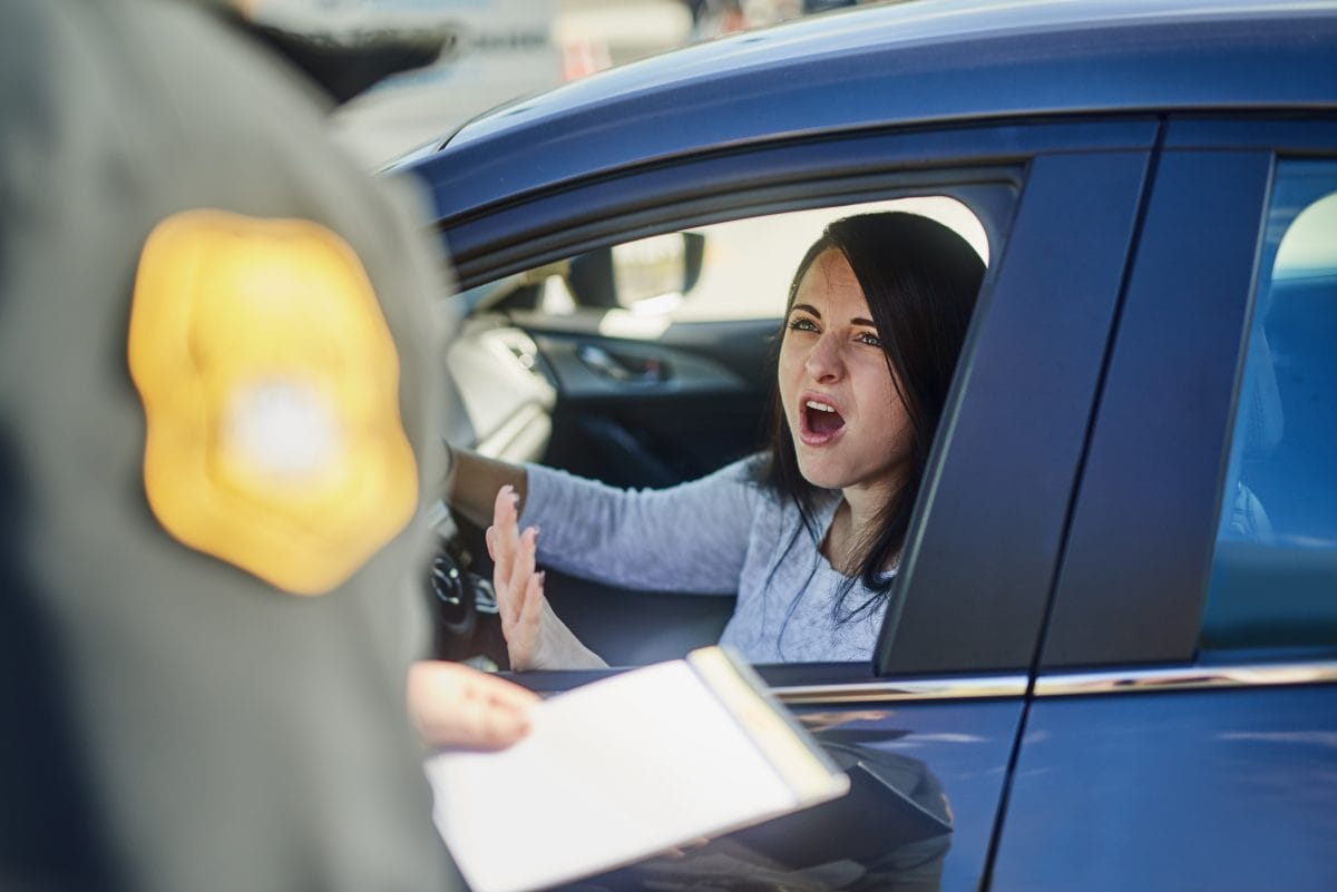 woman yelling at police after a drunk driving accident